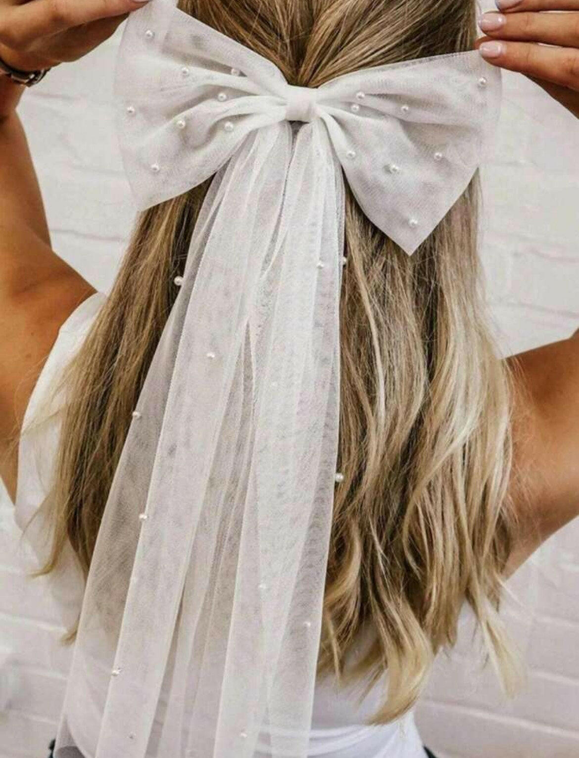 A Bow Hair Clip with Faux Pearls