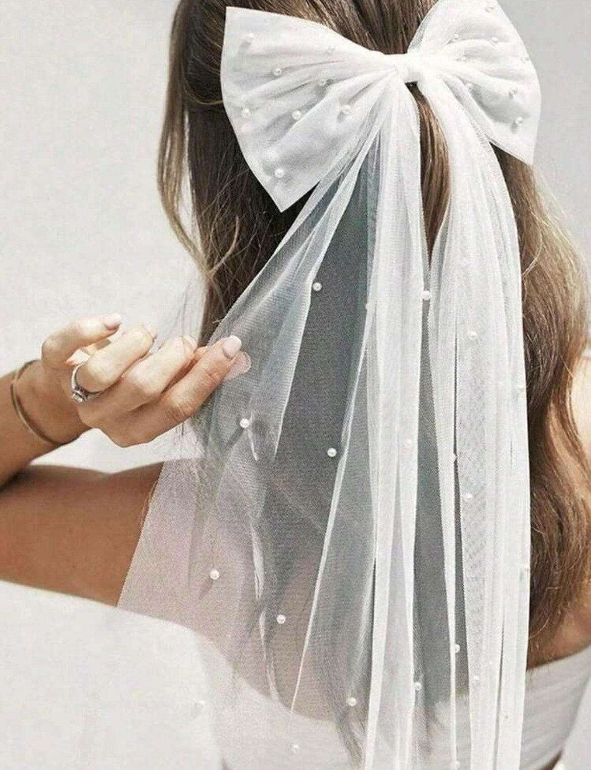 A Bow Hair Clip with Faux Pearls