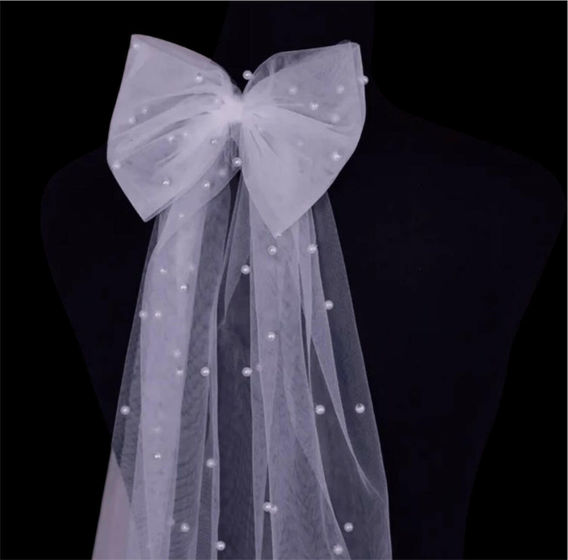 A Bow Hair Clip with Faux Pearls