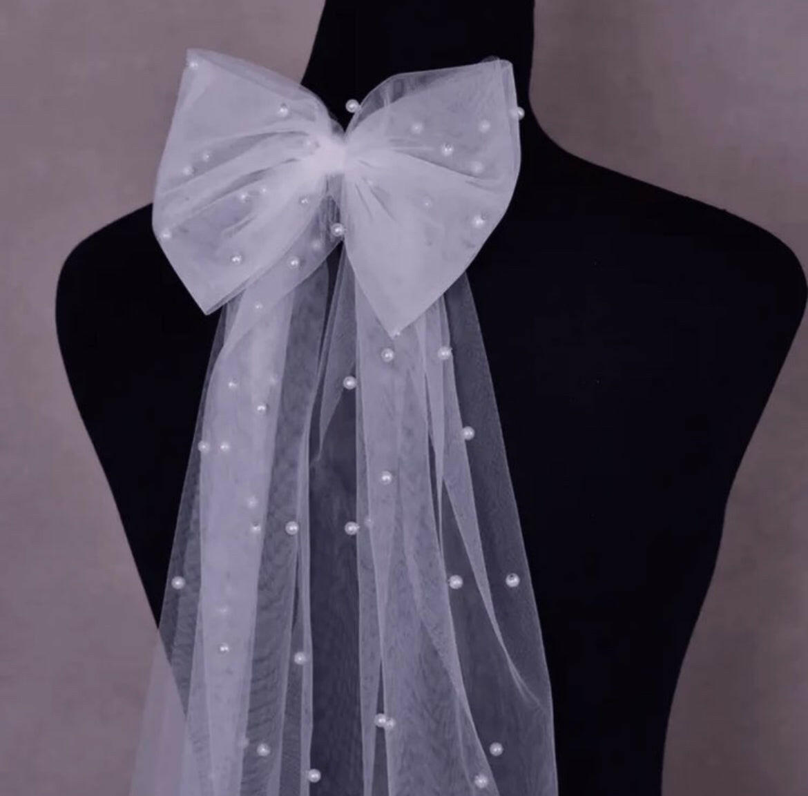 A Bow Hair Clip with Faux Pearls