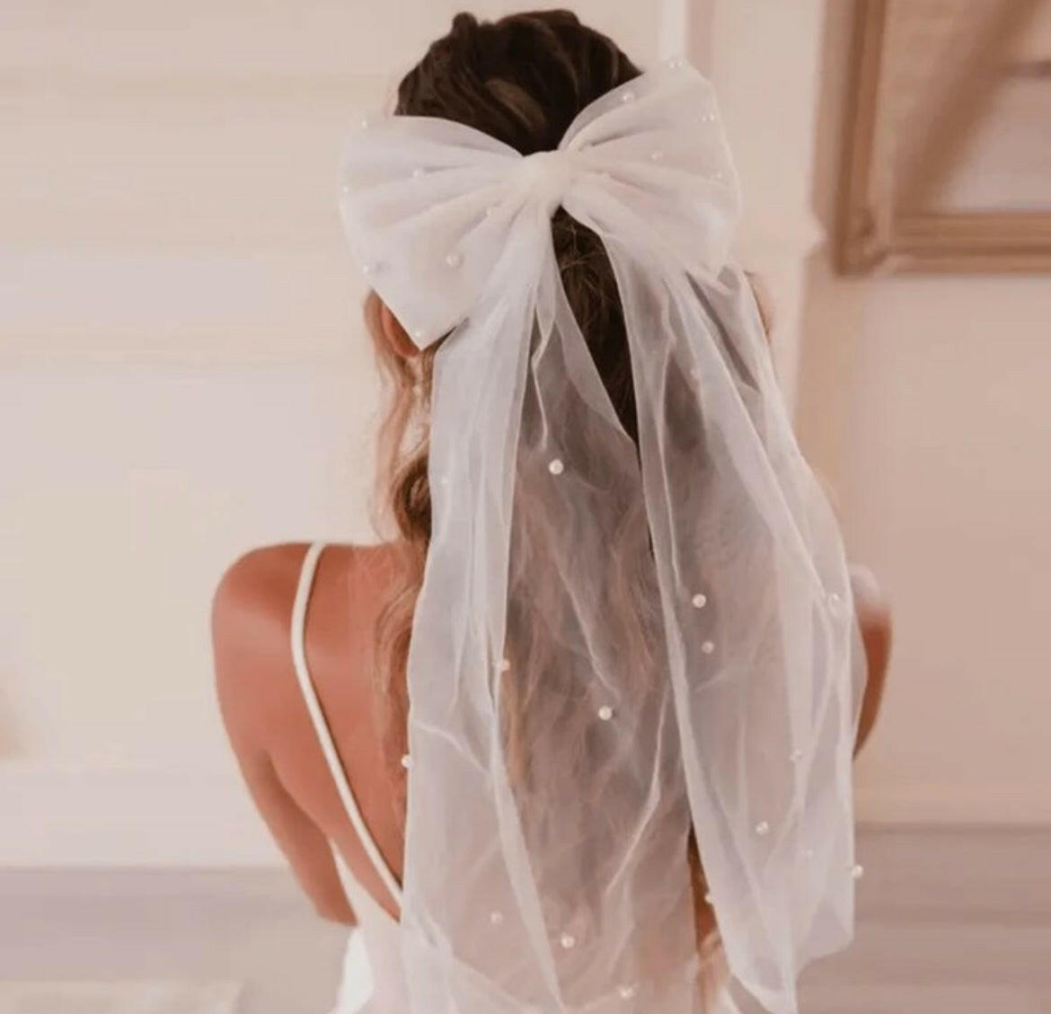 A Bow Hair Clip with Faux Pearls